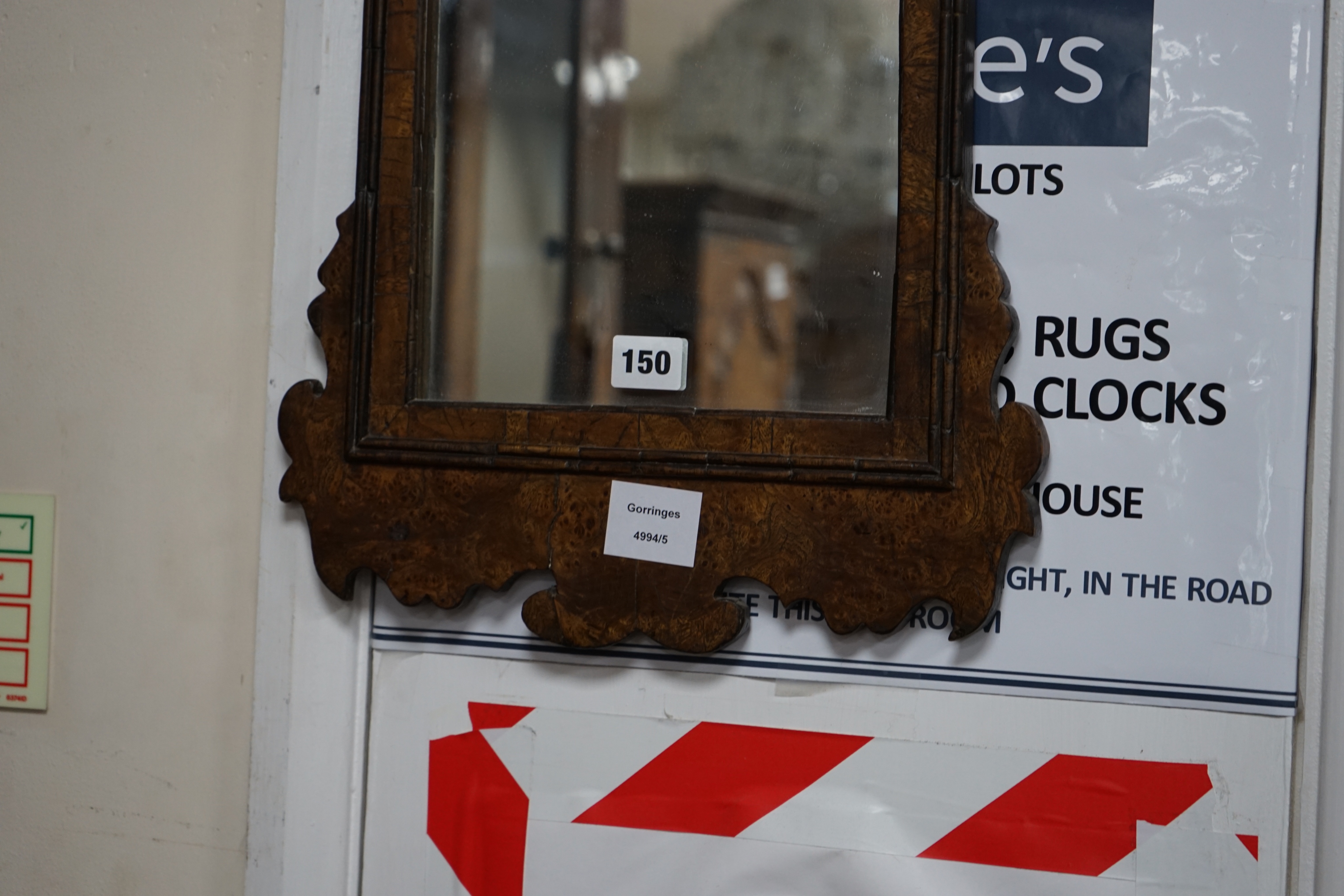 A small burr oak veneered fret cut wall mirror, width 34cm height 53cm